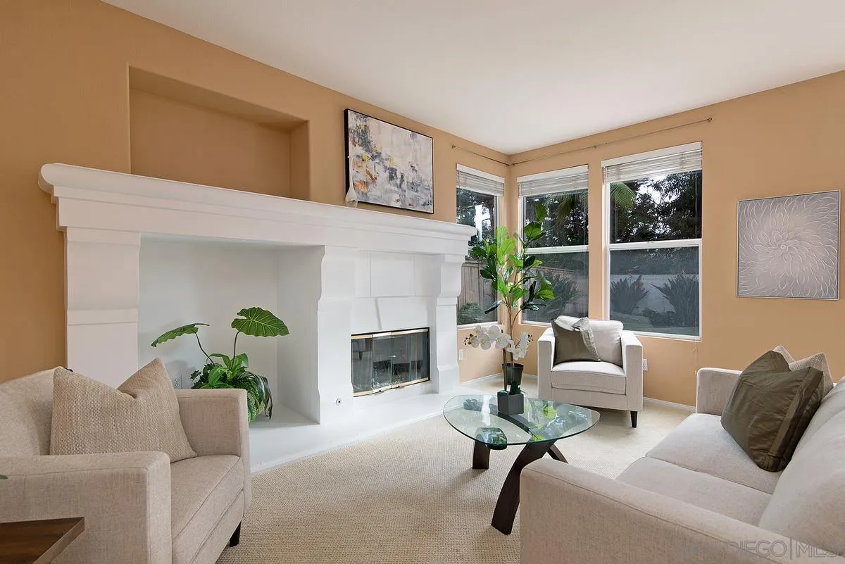 4951 Riding Ridge Road San Diego, CA 92130 - Photo 9 of 32 a living room with furniture and a fireplace