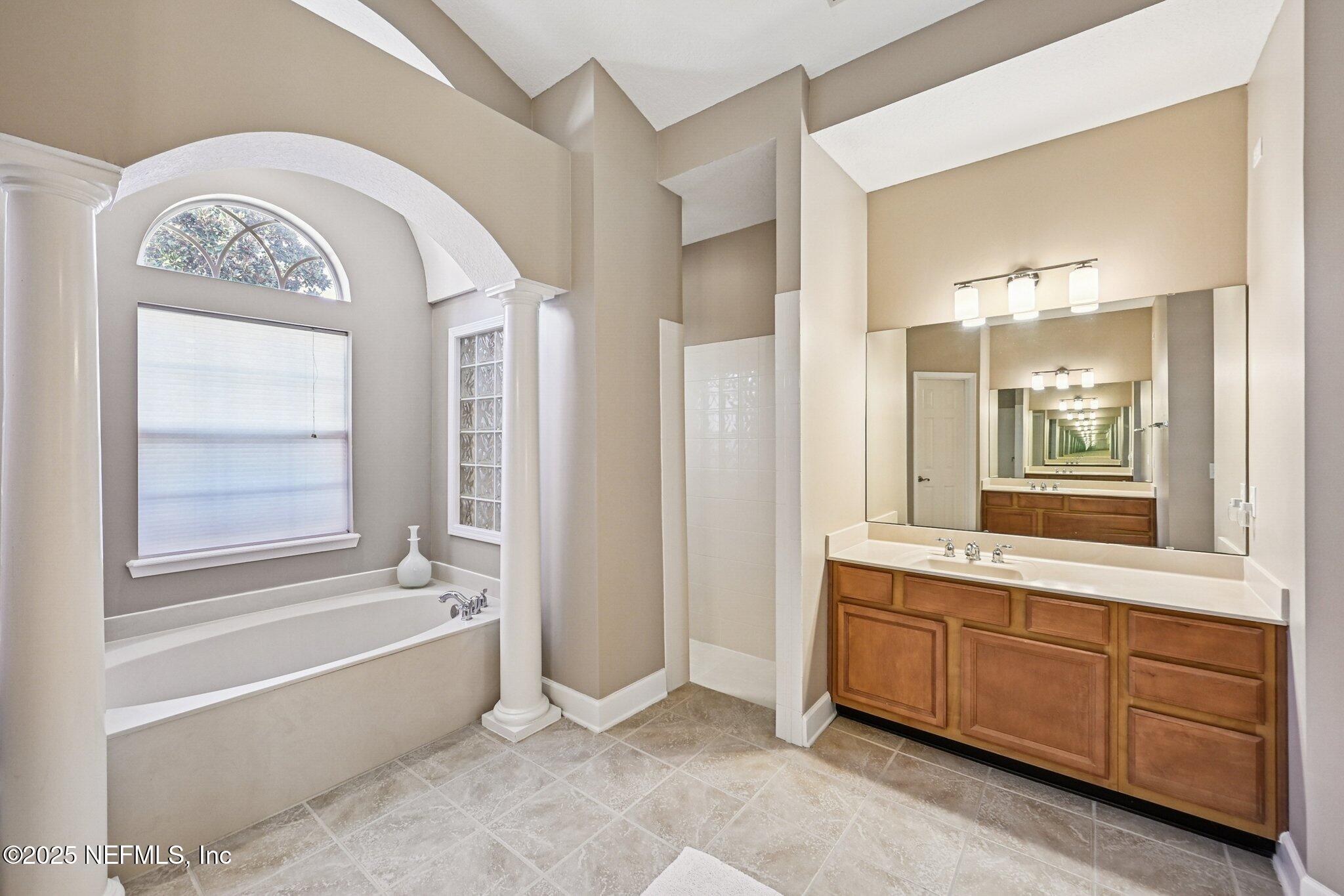 5300 Rising Sun Court St. Johns, FL 32259 - Photo 18 of 43 a spacious bathroom with a tub sink and mirror