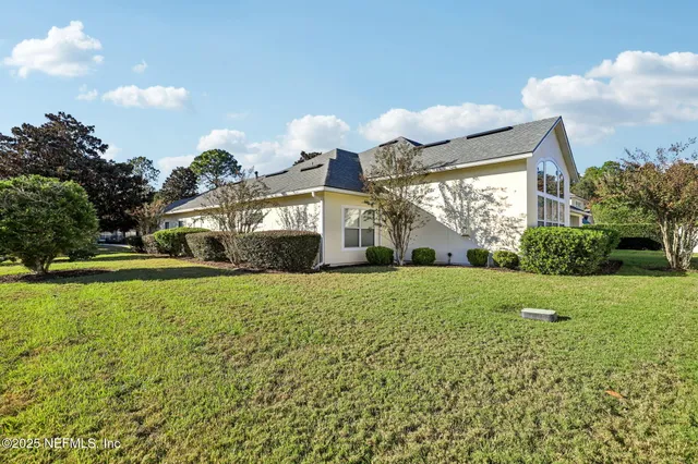 a view of the front of house with outdoor seating