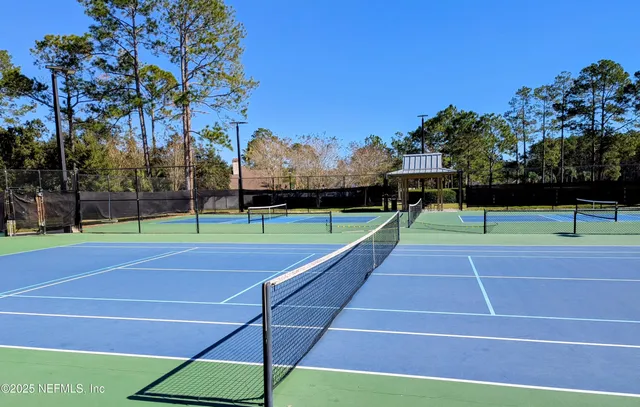 a view of a swimming pool with chairs