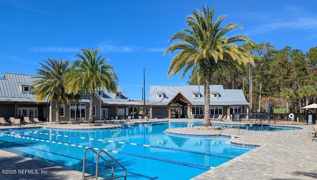 5300 Rising Sun Court St. Johns, FL 32259 - Photo 34 of 43 a view of a swimming pool with chairs