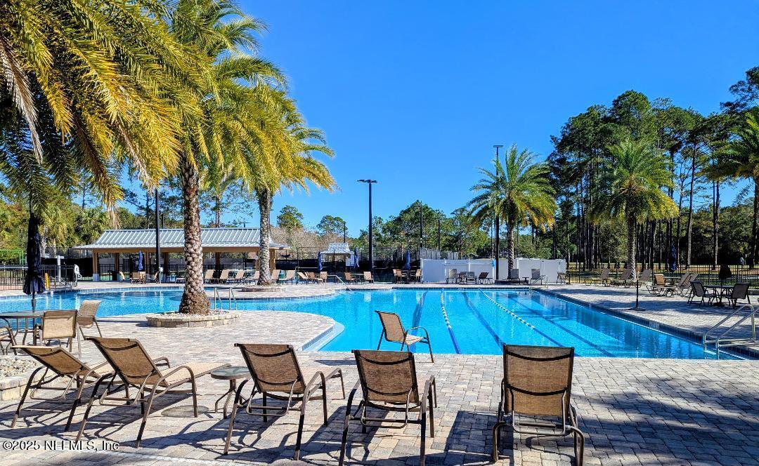 5300 Rising Sun Court St. Johns, FL 32259 - Photo 35 of 43 a swimming pool with outdoor seating and yard
