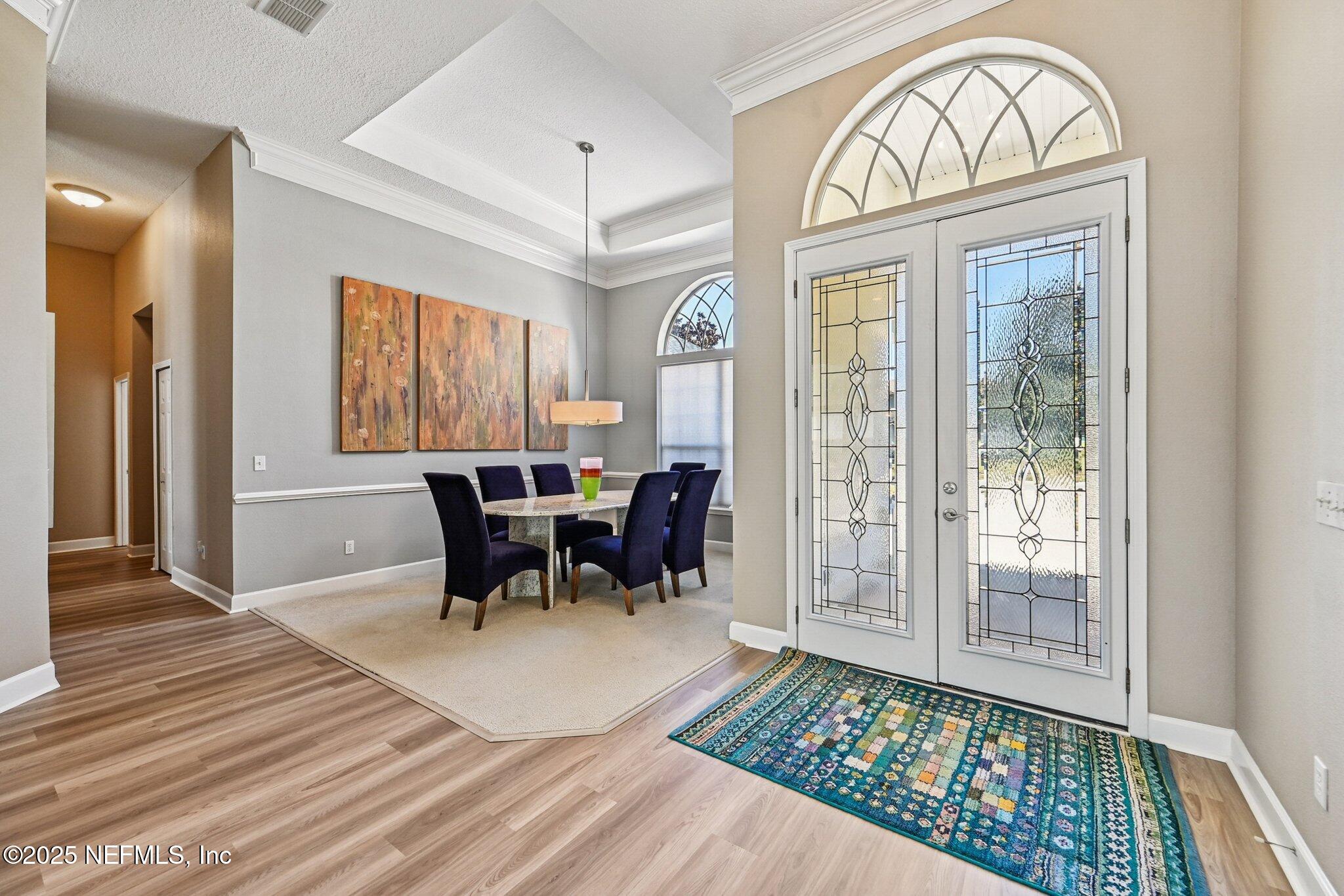 5300 Rising Sun Court St. Johns, FL 32259 - Photo 7 of 43 a view of a dining room with furniture window and wooden floor