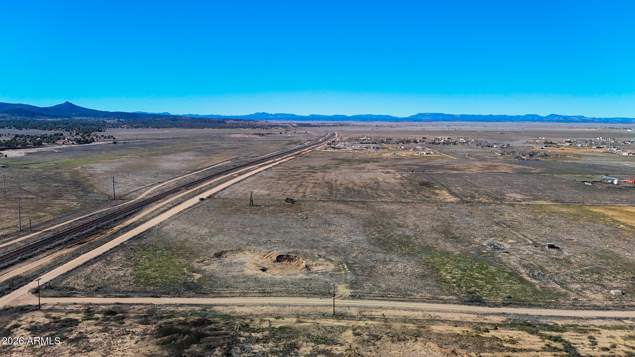 2300 Santa Fe Road Paulden, AZ 86334 - Photo 6 of 21 a view of a dry yard with wooden floor and fence