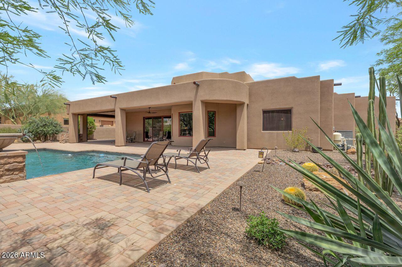 18507 East Picacho Road Rio Verde, AZ 85263 - Photo 30 of 33 a view of a house with backyard porch and sitting area