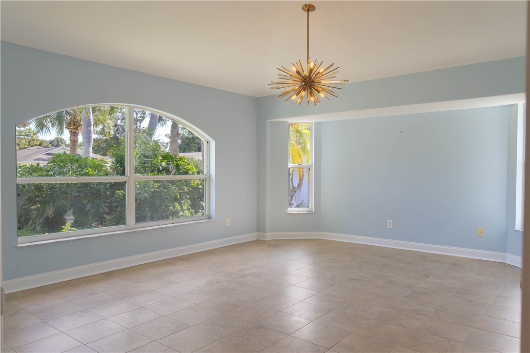 122 Coconut Street Sebastian, FL 32958 - Photo 20 of 36 an empty room with windows and natural light