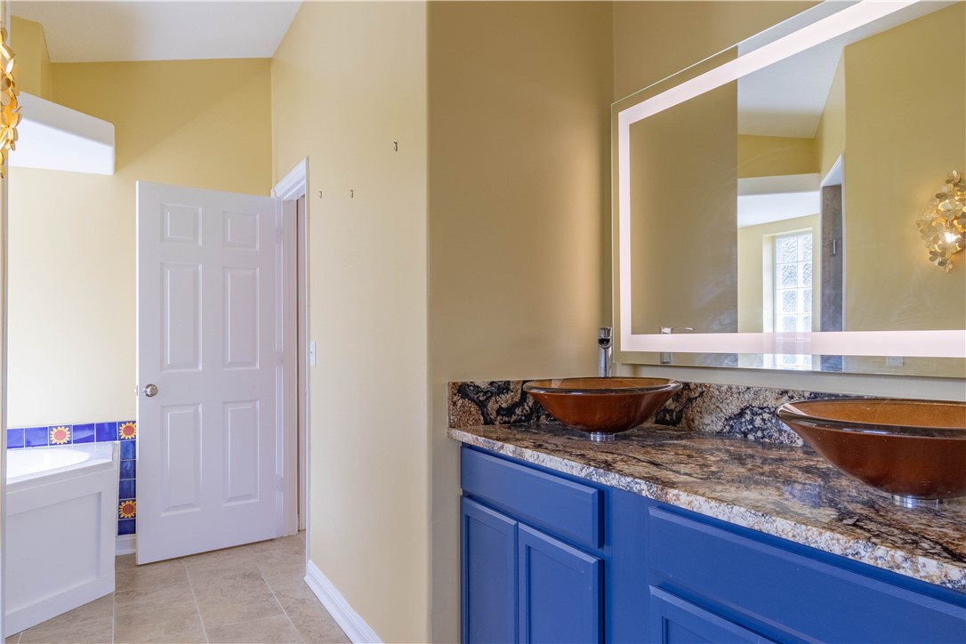 122 Coconut Street Sebastian, FL 32958 - Photo 26 of 36 a bathroom with a granite countertop sink and a mirror