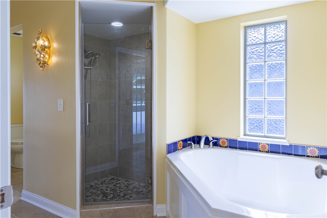 122 Coconut Street Sebastian, FL 32958 - Photo 27 of 36 a bathroom with a bathtub and a shower