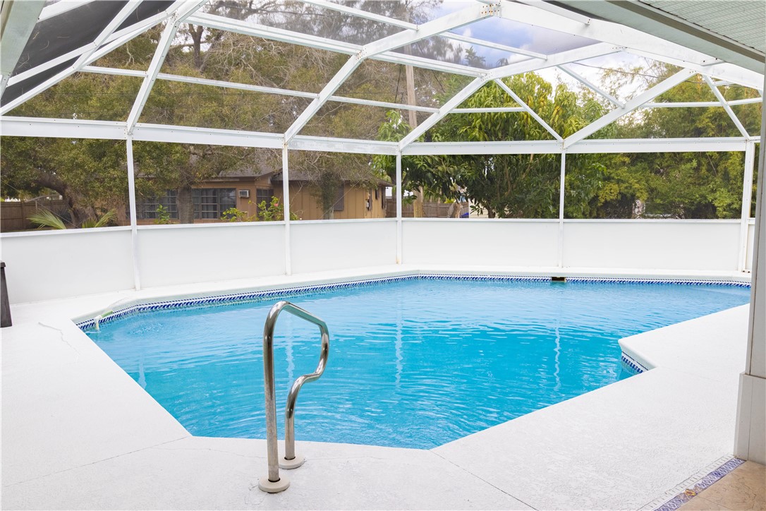 122 Coconut Street Sebastian, FL 32958 - Photo 29 of 36 a view of a swimming pool with a chair