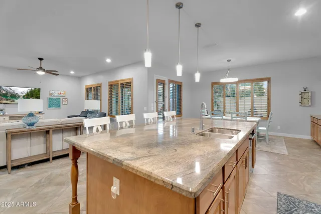 a kitchen with stainless steel appliances granite countertop a stove and a refrigerator