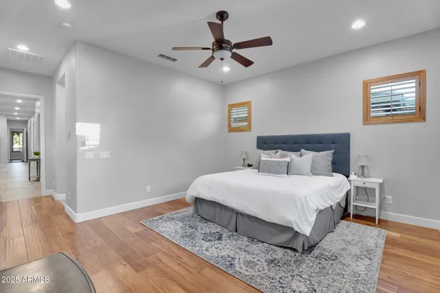 a bathroom with a granite countertop sink and a bathtub