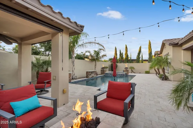 an aerial view of a house with garden space and street view