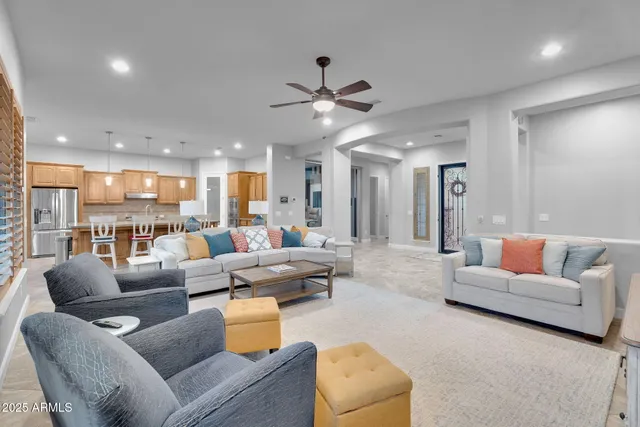 a kitchen with center island table and chairs