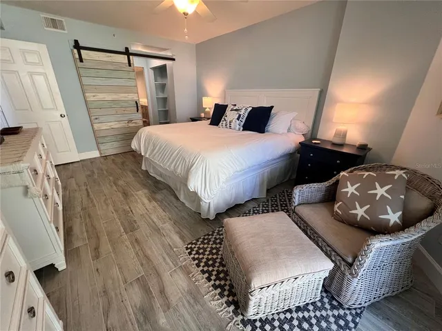 a bedroom with bed and a couch