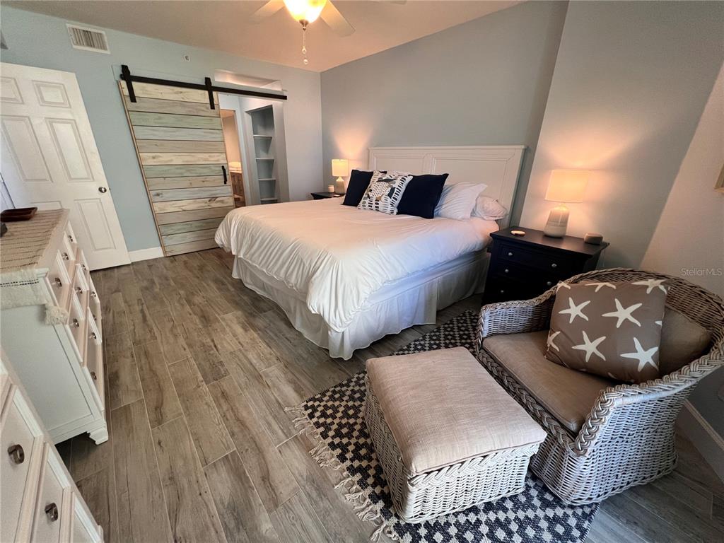 4565 South Atlantic Avenue, Unit 5203 Ponce Inlet, FL 32127 - Photo 15 of 28 a bedroom with bed and a couch