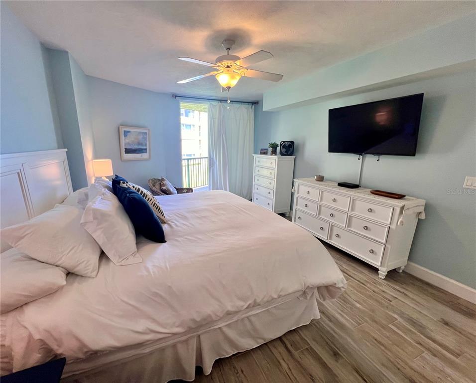 4565 South Atlantic Avenue, Unit 5203 Ponce Inlet, FL 32127 - Photo 20 of 28 a bedroom with a bed and a flat screen tv