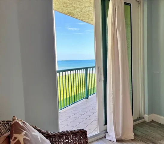 a bedroom with a bed window and a chair