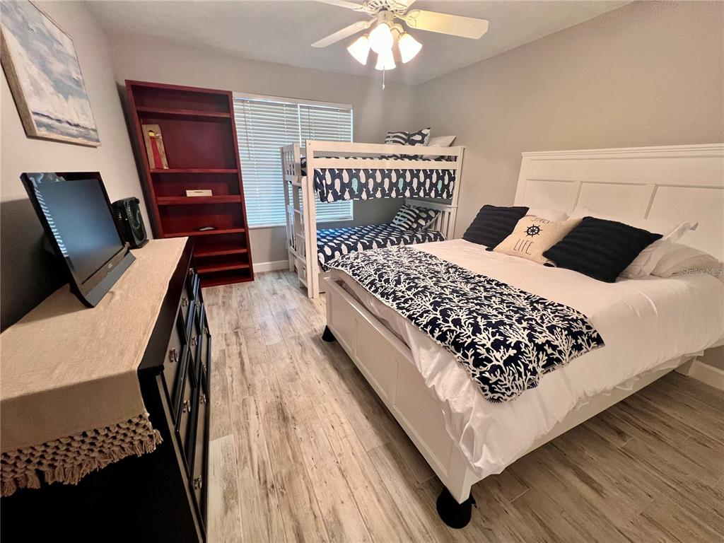 4565 South Atlantic Avenue, Unit 5203 Ponce Inlet, FL 32127 - Photo 22 of 28 a bedroom with a bed window and a chair