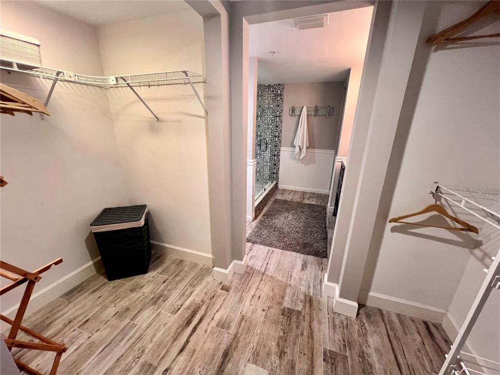 4565 South Atlantic Avenue, Unit 5203 Ponce Inlet, FL 32127 - Photo 27 of 28 a view of a closet with wooden floor