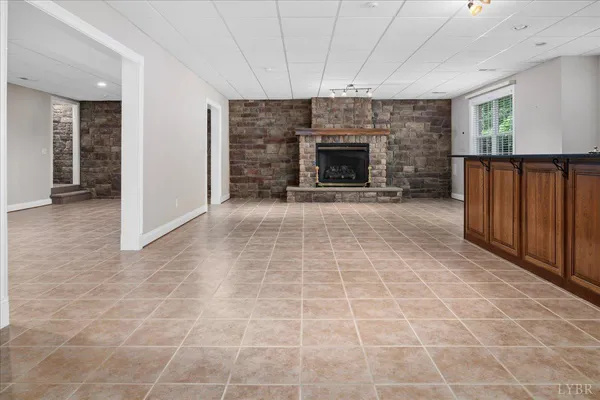 a view of an empty room with a fireplace