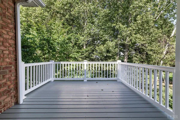 a balcony with view of a wooden floor