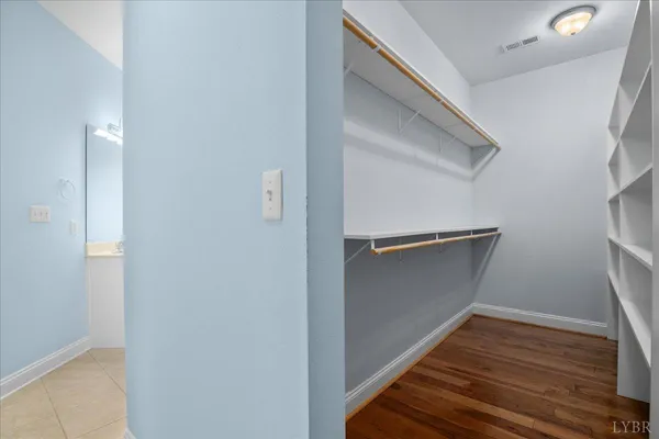 a utility room with a sink a mirror and vanity