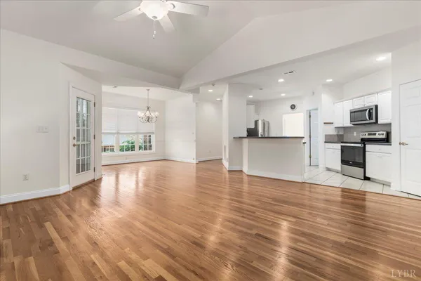 a view of a kitchen with a sink and a stove top oven