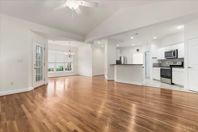 a view of a kitchen with a sink and a stove top oven