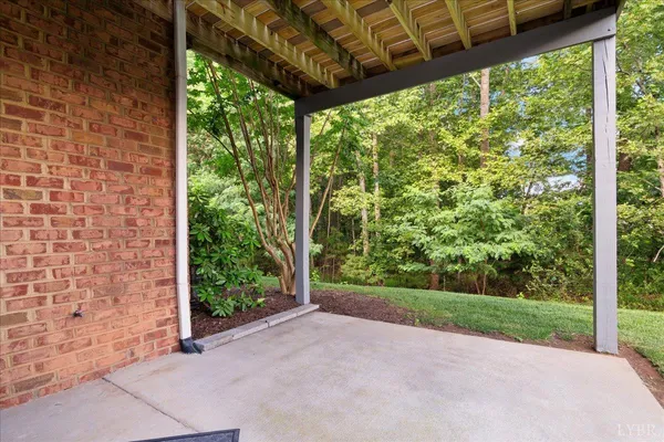 a view of a small house with backyard