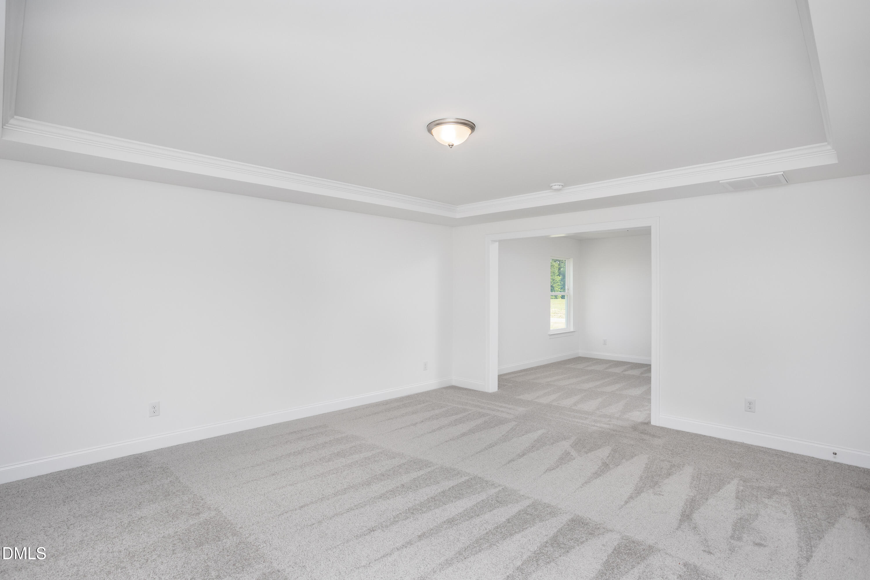 216 Cedar Rdg Trail Angier, NC 27501 - Photo 24 of 33 a view of an empty room with wooden floor and a window