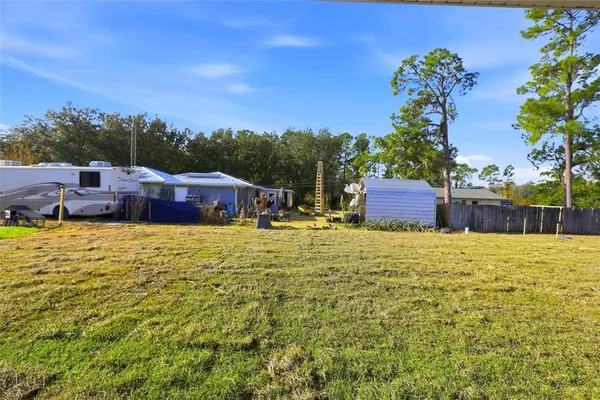 a view of a yard with an outdoor space