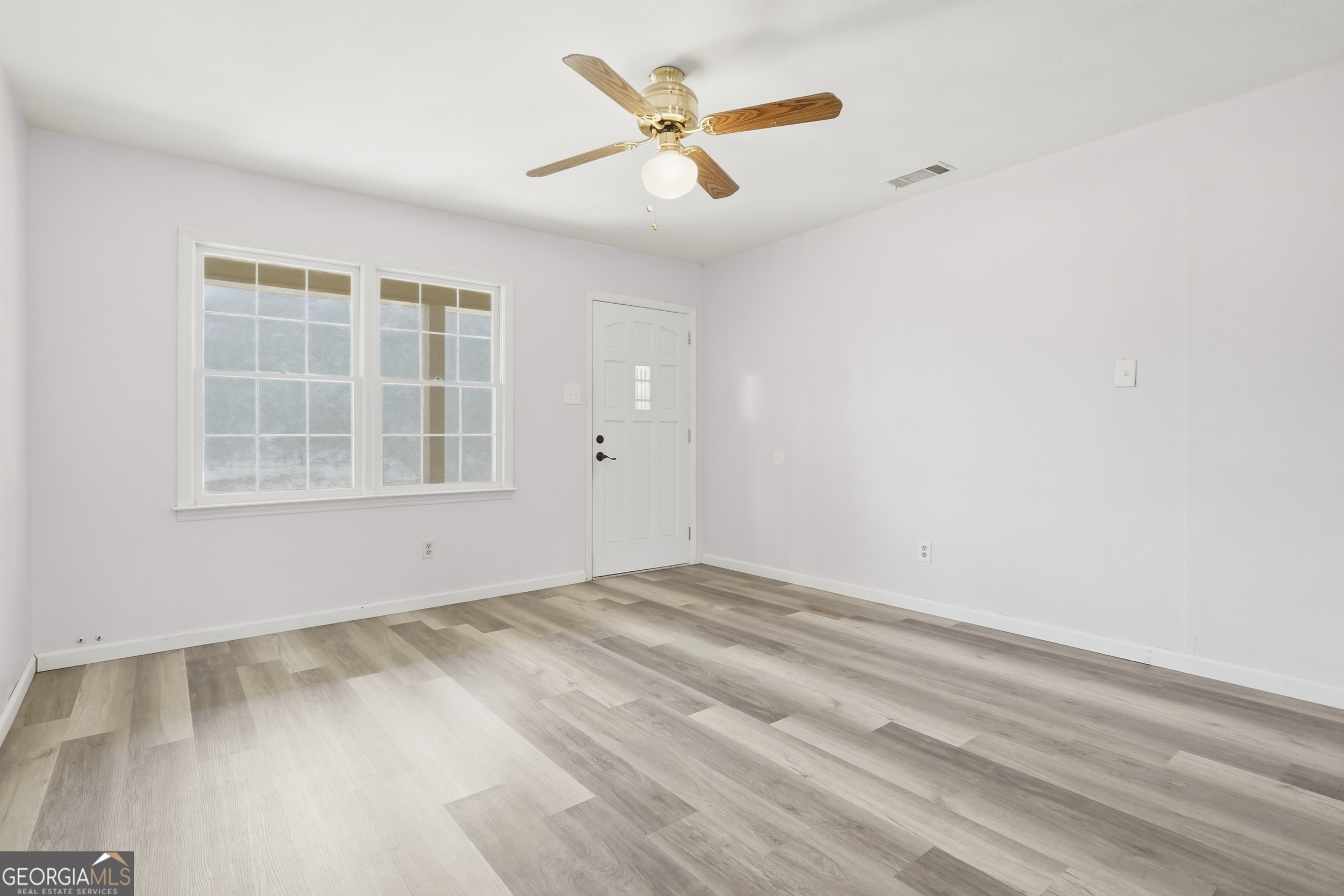 3710 Coakley Avenue Albany, GA 31721 - Photo 12 of 47 an empty room with windows and fan