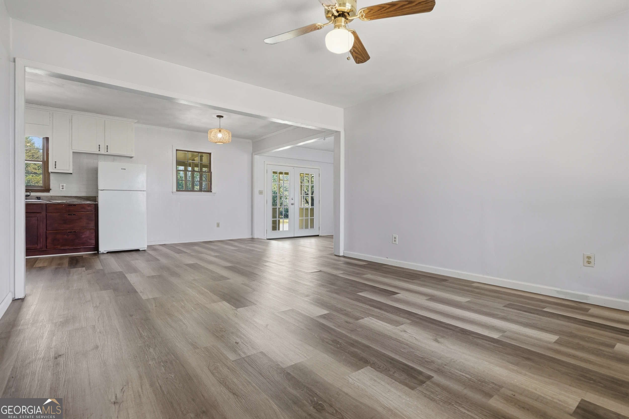 3710 Coakley Avenue Albany, GA 31721 - Photo 16 of 47 wooden floor in an empty room with a window