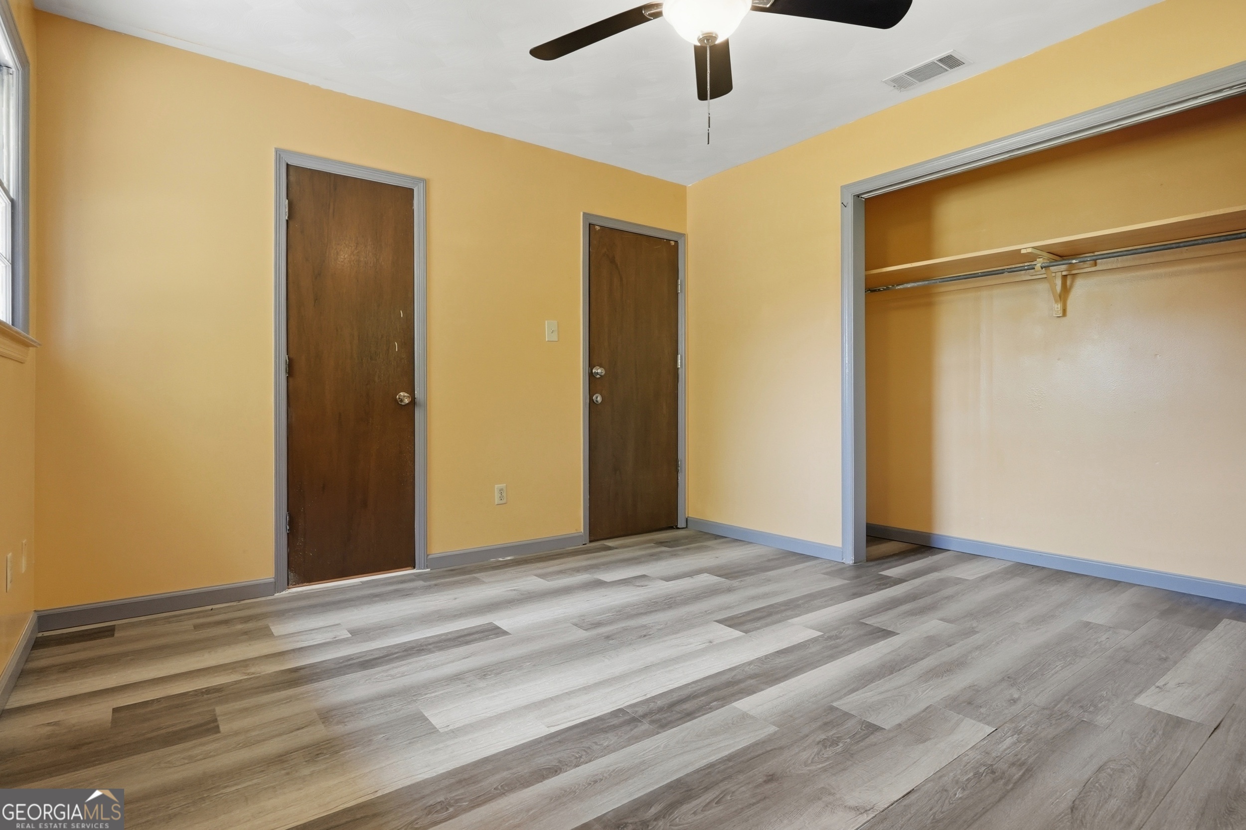 3710 Coakley Avenue Albany, GA 31721 - Photo 28 of 47 a view of an empty room with wooden floor