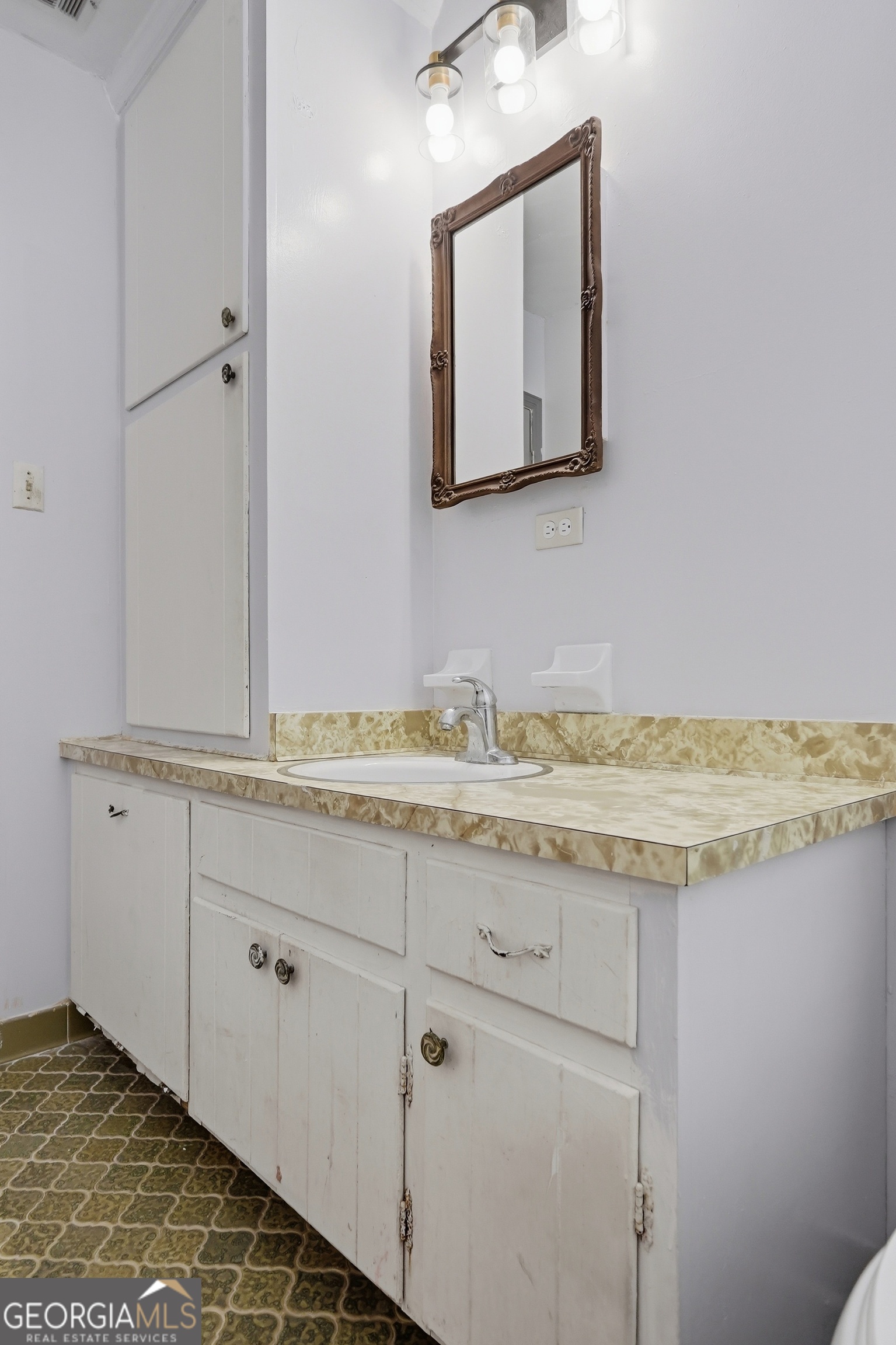3710 Coakley Avenue Albany, GA 31721 - Photo 31 of 47 a bathroom with a granite countertop sink and a mirror
