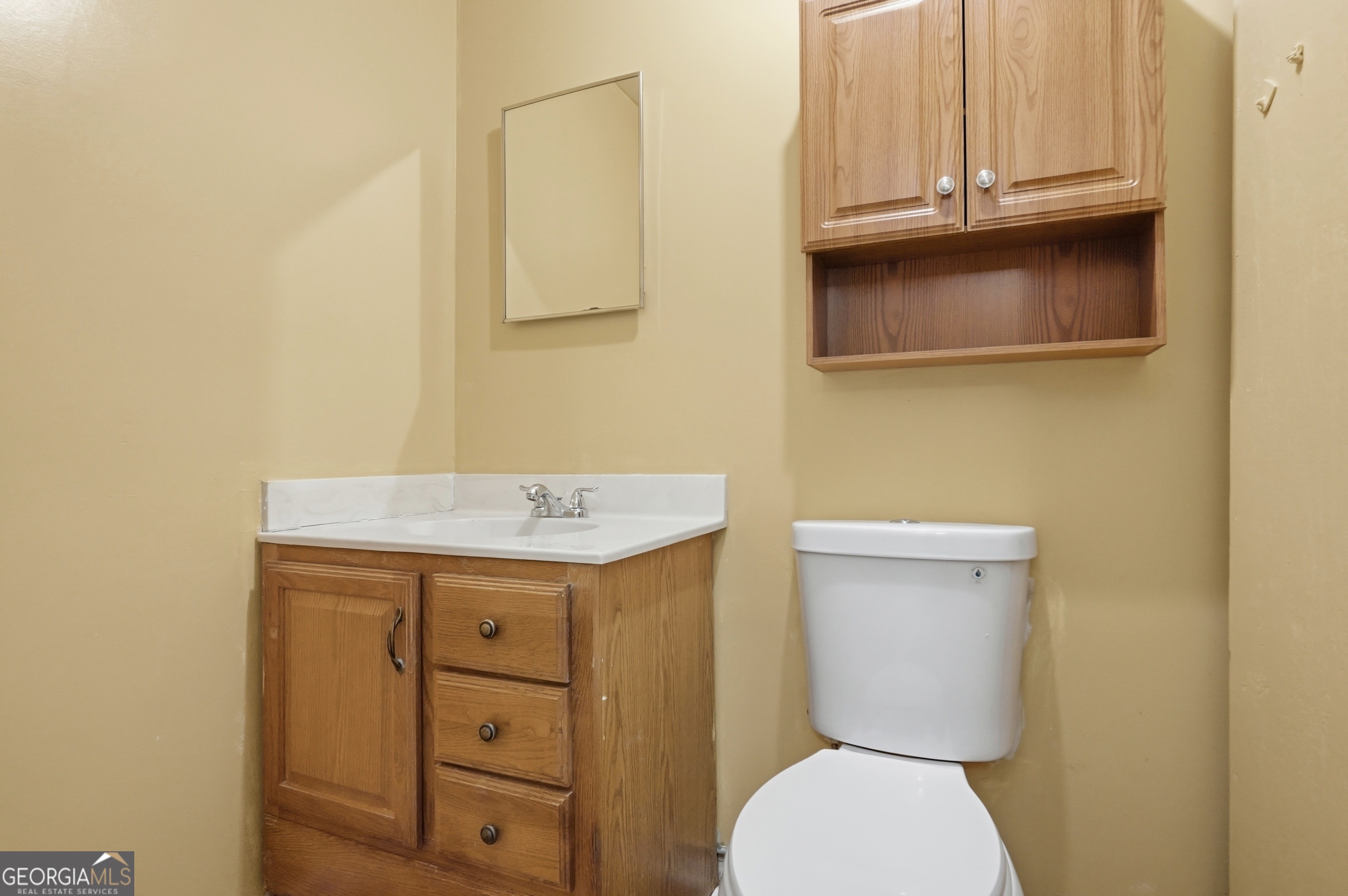 3710 Coakley Avenue Albany, GA 31721 - Photo 33 of 47 a bathroom with a sink a toilet and mirror