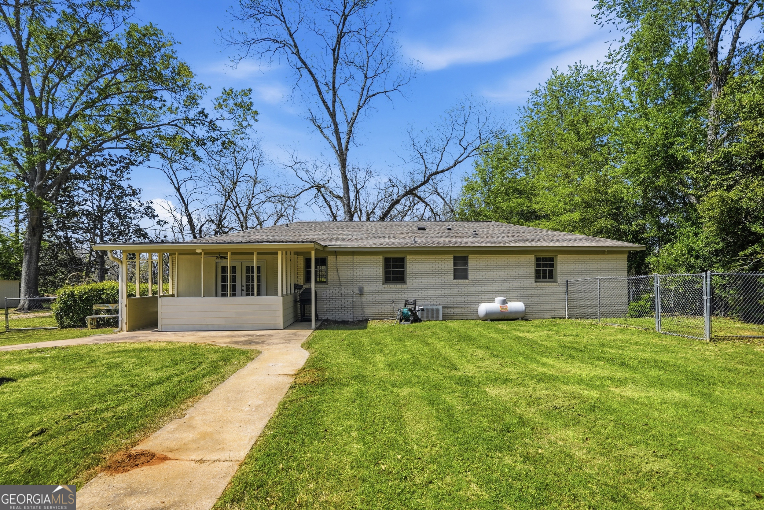3710 Coakley Avenue Albany, GA 31721 - Photo 39 of 47 a front view of a house with a yard and trees