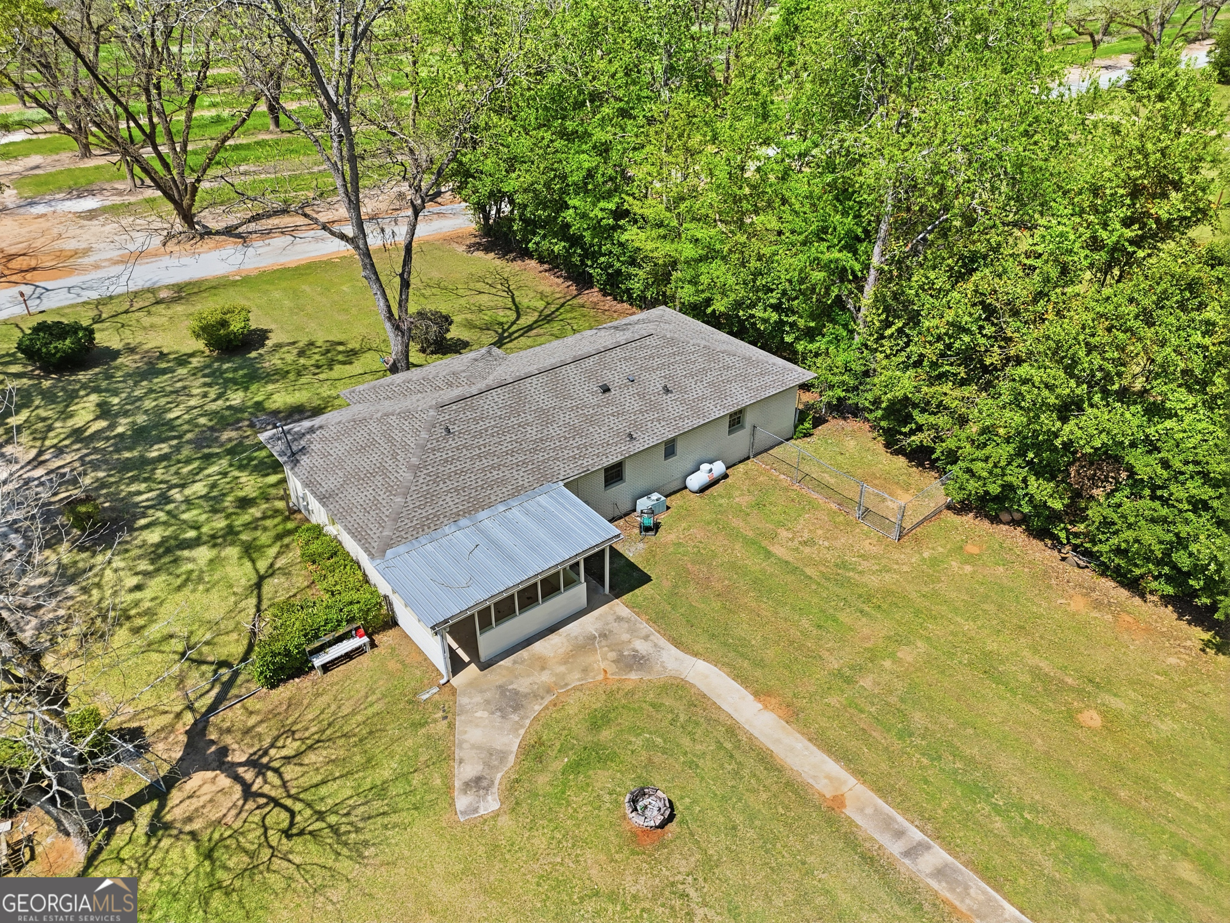 3710 Coakley Avenue Albany, GA 31721 - Photo 46 of 47 an aerial view of a house with swimming pool and large trees