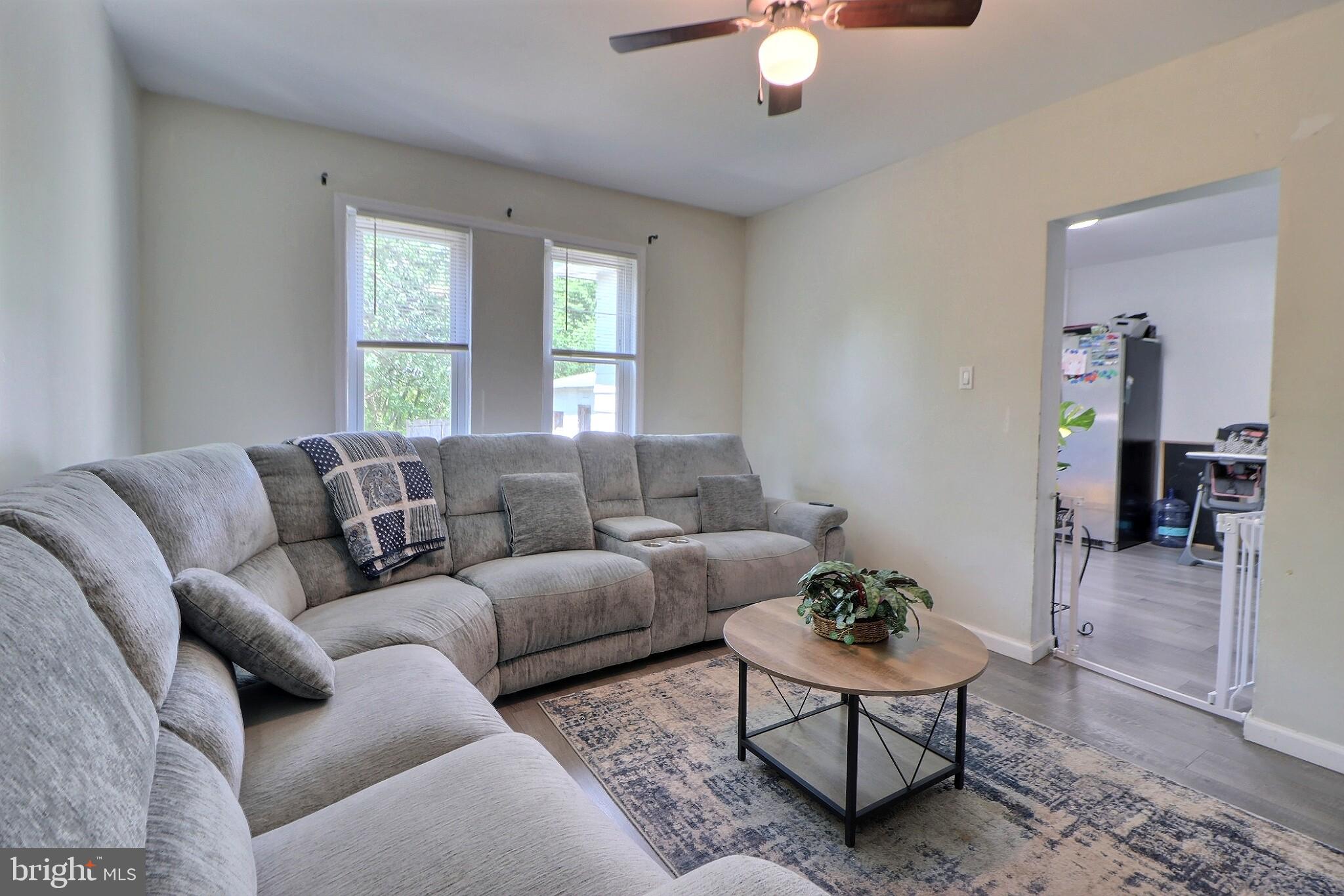 1022 Penn Line Road Paulsboro, NJ 08066 - Photo 10 of 19 a living room with furniture ceiling fan and a window