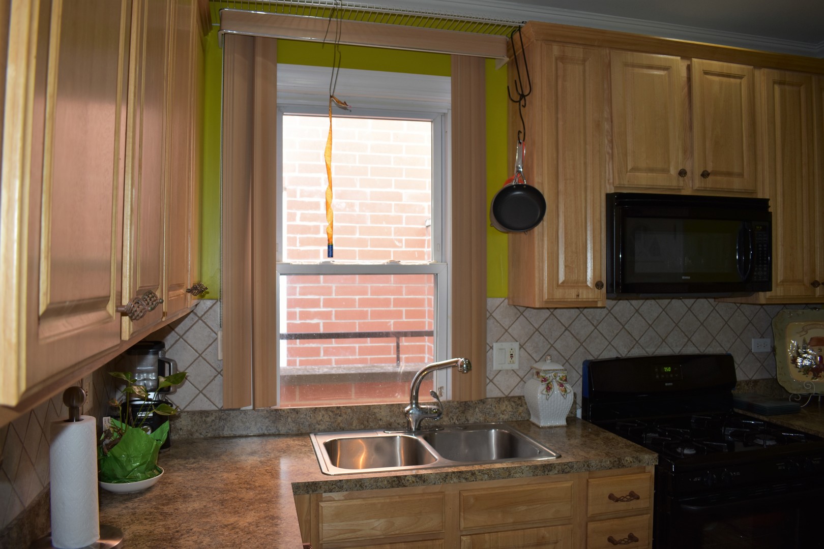 3539 North Pulaski Road Chicago, IL 60641 - Photo 2 of 23 a kitchen with a sink a oven and a window