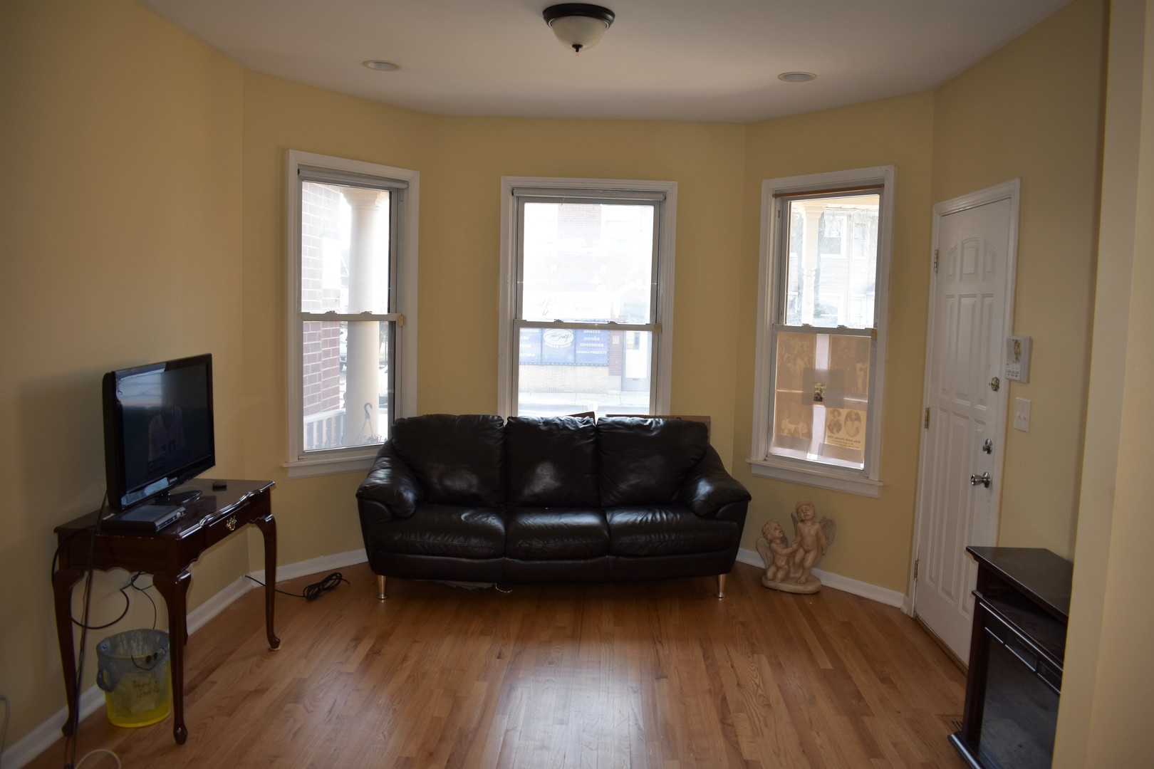 3539 North Pulaski Road Chicago, IL 60641 - Photo 11 of 23 a living room with furniture and a flat screen tv