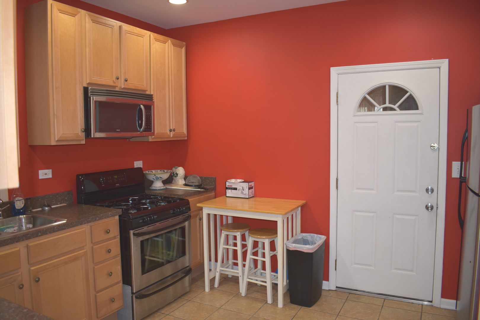 3539 North Pulaski Road Chicago, IL 60641 - Photo 15 of 23 a kitchen with stainless steel appliances granite countertop a stove top oven