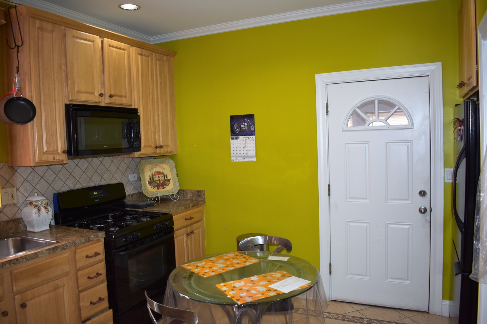 3539 North Pulaski Road Chicago, IL 60641 - Photo 5 of 23 a kitchen with a sink a stove and refrigerator
