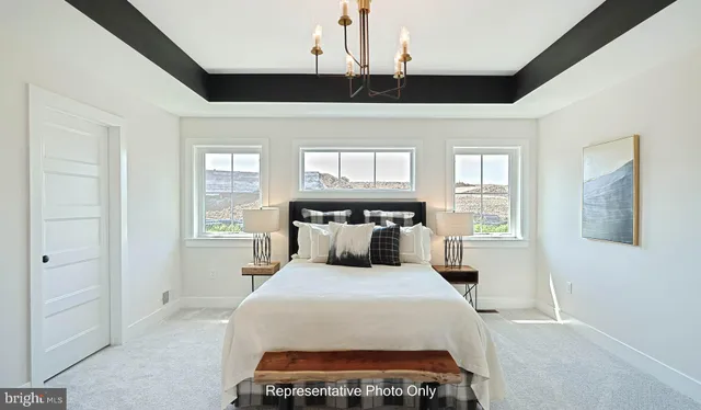 a bed room with a bed and a window