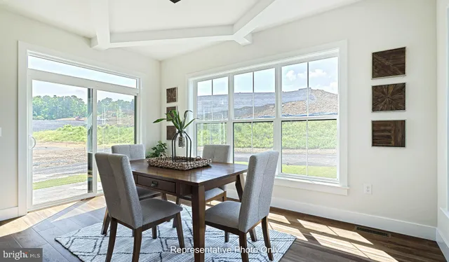 a dining room with furniture window wooden floor