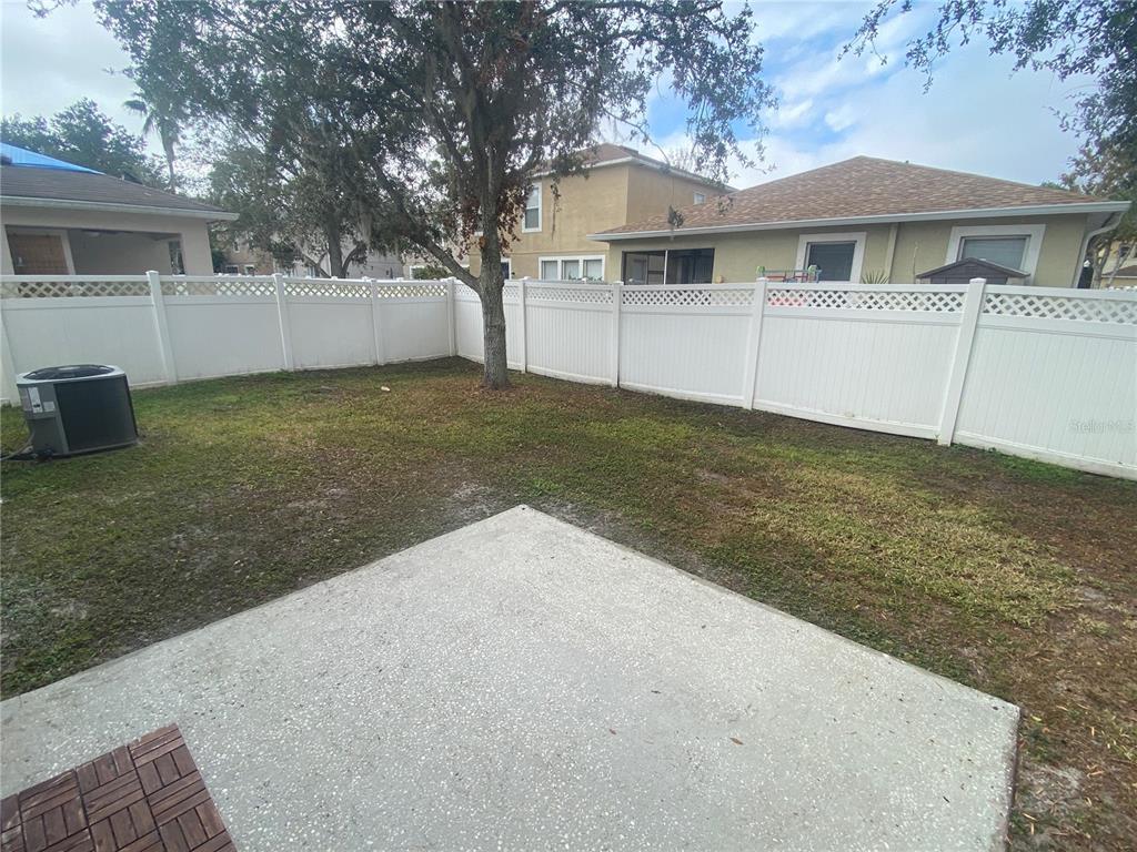 2409 Spring Hollow Loop Wesley Chapel, FL 33544 - Photo 27 of 47 a view of a house with a yard