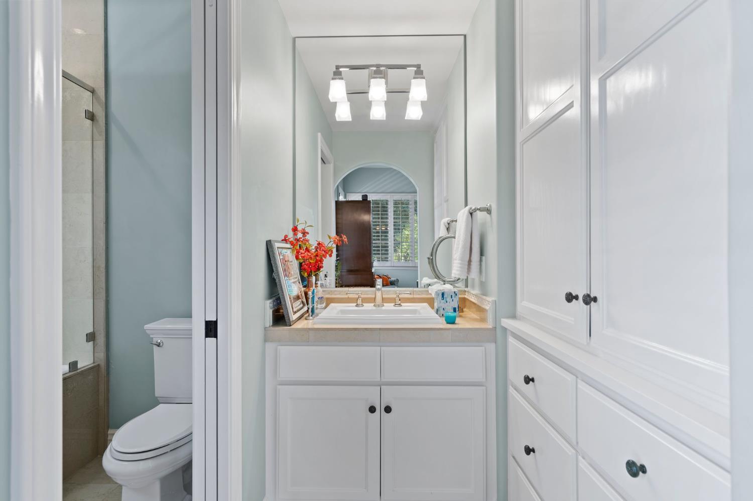 10676 Wilton Road Elk Grove, CA 95624 - Photo 35 of 71 a bathroom with a sink vanity granite toilet and a mirror