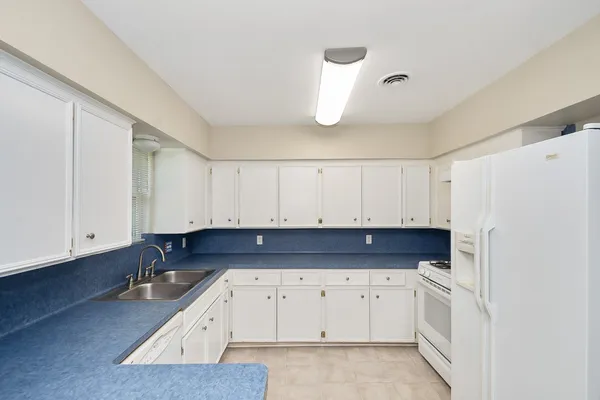a view of kitchen with cabinets and stainless steel appliances