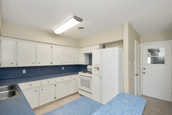 a view of kitchen with electric appliances