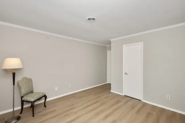 a view of a room with wooden floor and outdoor seating